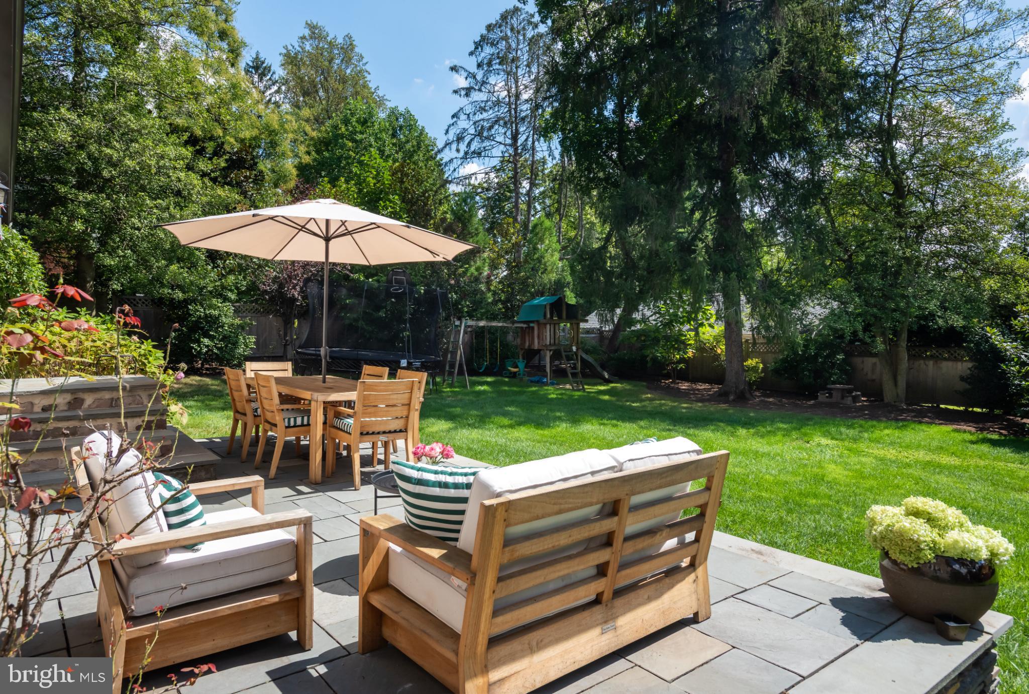 315 Caversham Road Bryn Mawr, PA 19010 - Photo 54 of 55 Sunny backyard oasis with lush greenery.