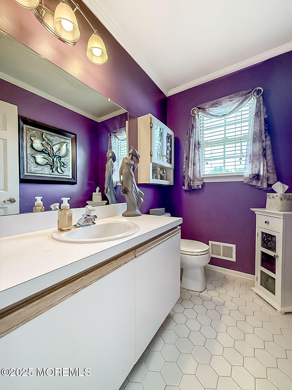 22 Abraham Drive Howell, NJ 07731 - Photo 14 of 24 a bathroom with a toilet sink and mirror