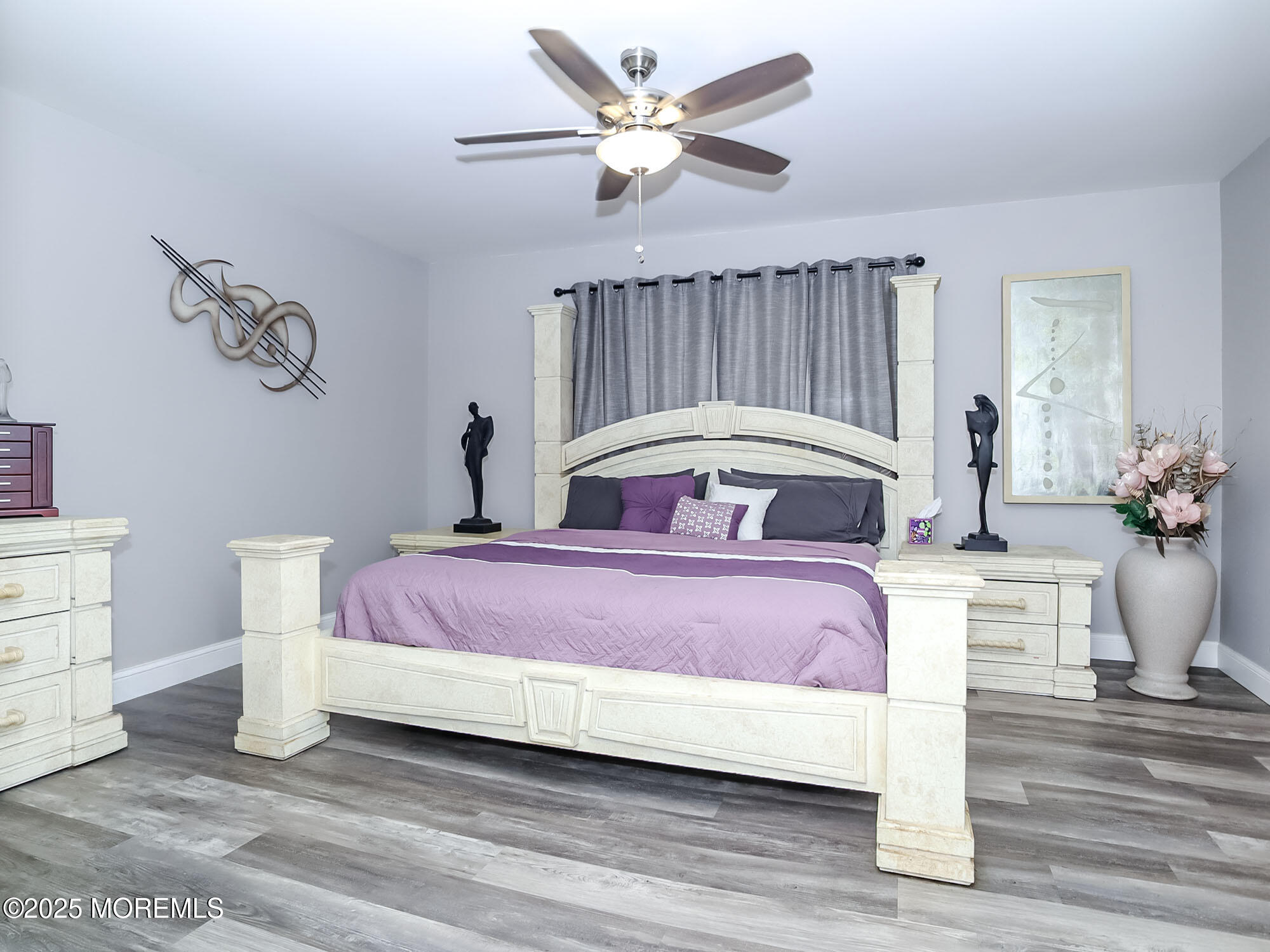 22 Abraham Drive Howell, NJ 07731 - Photo 16 of 24 a bedroom with a bed and a chandelier