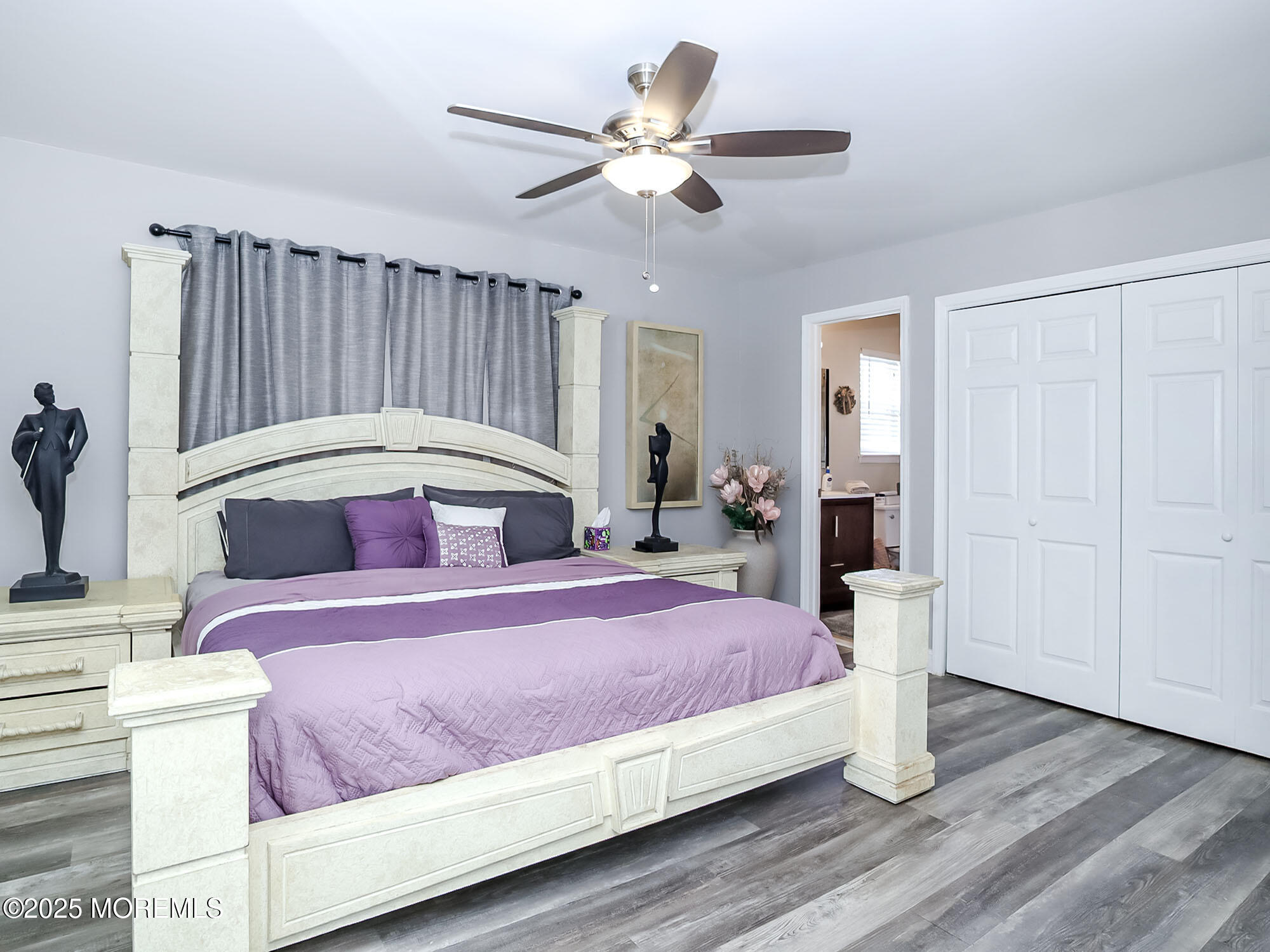 22 Abraham Drive Howell, NJ 07731 - Photo 18 of 24 a bedroom with a bed and a chandelier