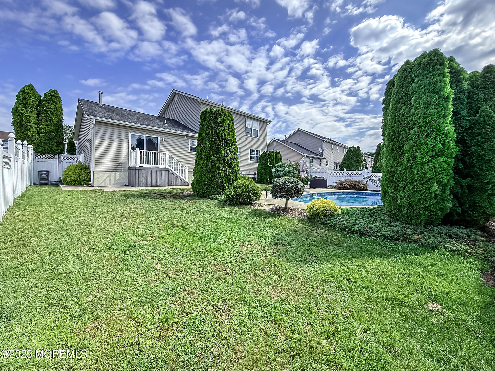 22 Abraham Drive Howell, NJ 07731 - Photo 2 of 24 a front view of a house with a yard and garage