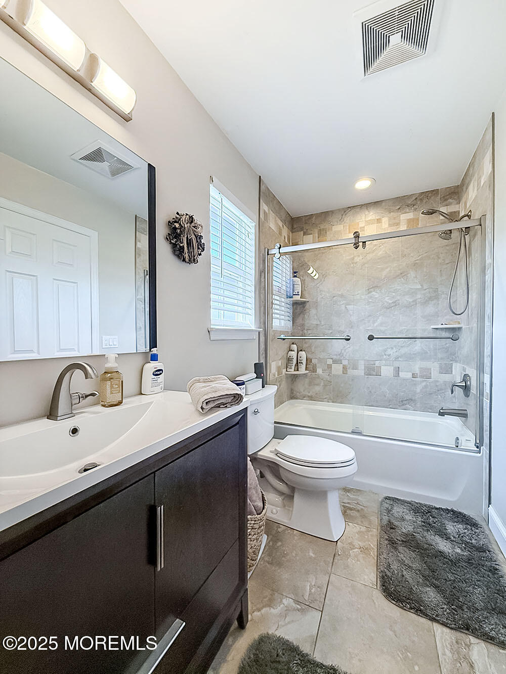 22 Abraham Drive Howell, NJ 07731 - Photo 21 of 24 a bathroom with a sink toilet a mirror and shower