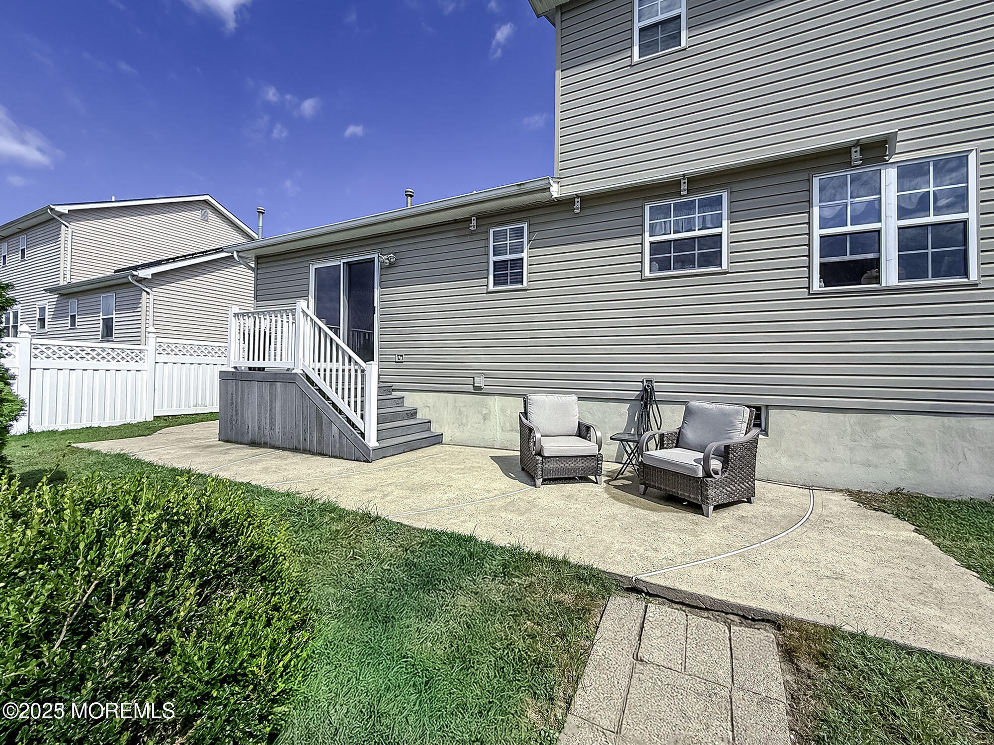 22 Abraham Drive Howell, NJ 07731 - Photo 3 of 24 a backyard of a house with fire pit and chairs