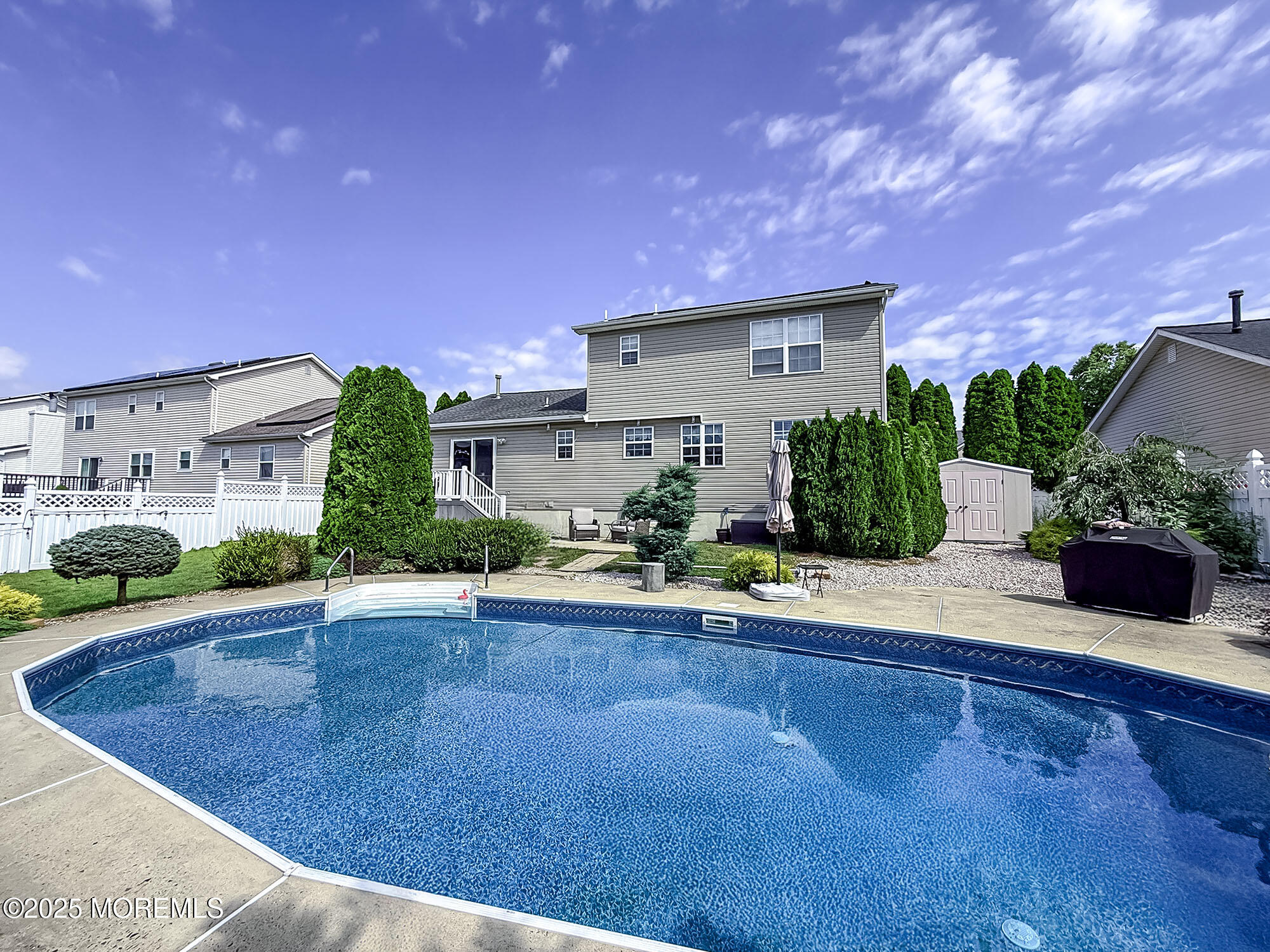 22 Abraham Drive Howell, NJ 07731 - Photo 5 of 24 a view of a house with pool and a yard
