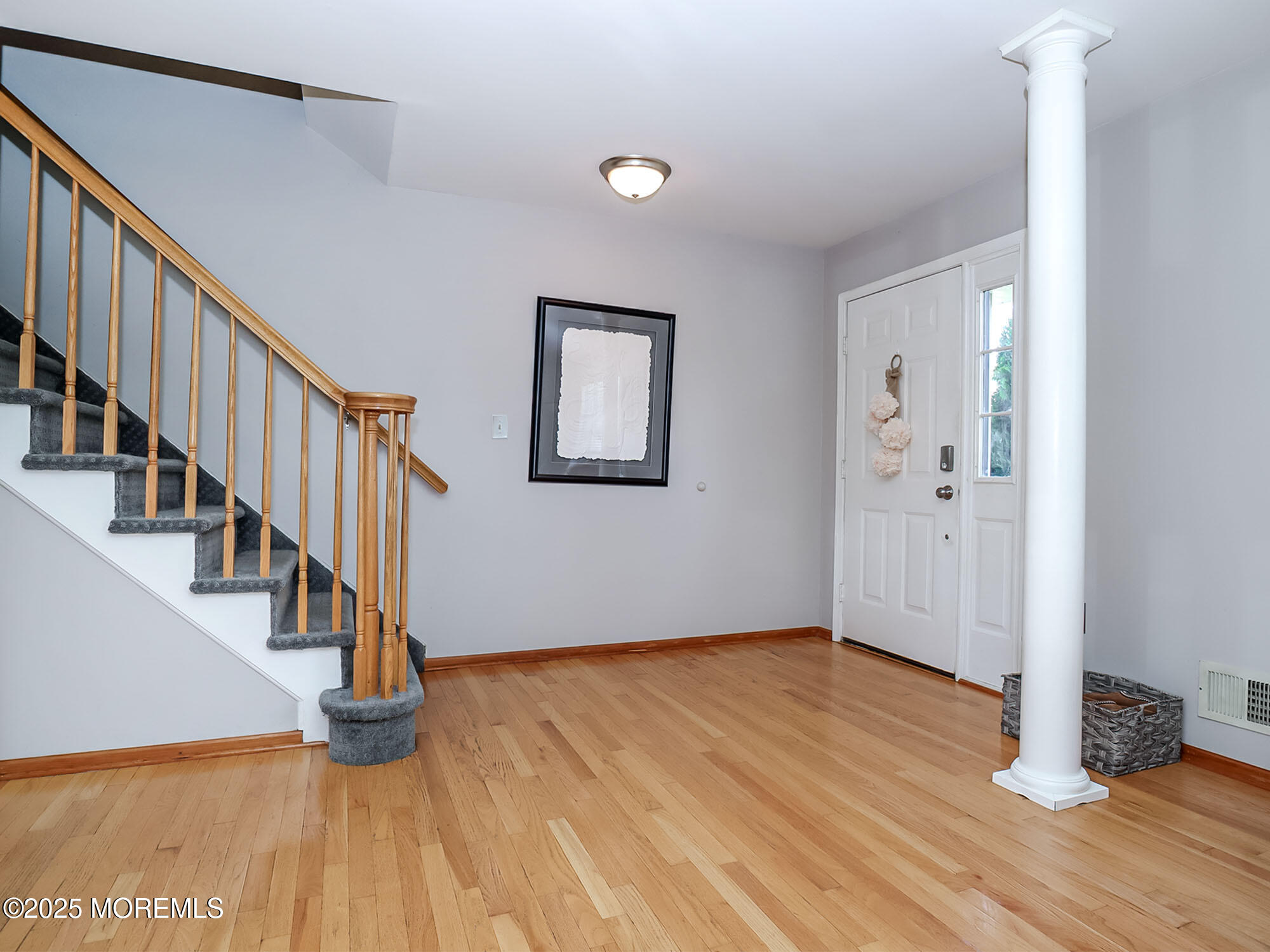 22 Abraham Drive Howell, NJ 07731 - Photo 6 of 24 a view of an entryway with wooden floor