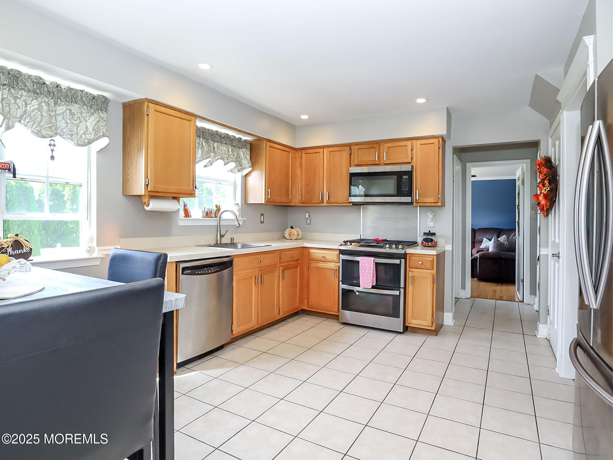 22 Abraham Drive Howell, NJ 07731 - Photo 10 of 24 a kitchen with stainless steel appliances granite countertop a stove top oven a sink a counter top space and cabinets