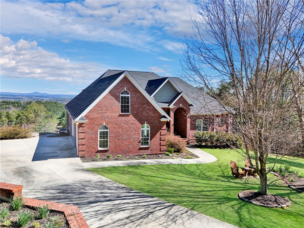 This brick home offers serene mountain views.
