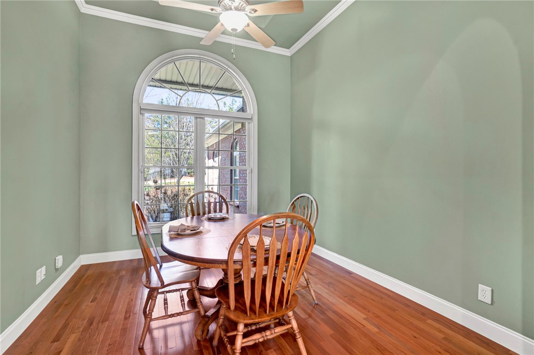603 Tamassee Ridge Way Salem, SC 29676 - Photo 11 of 46 This dining area features rich hardwood floors and an elegant arched window.