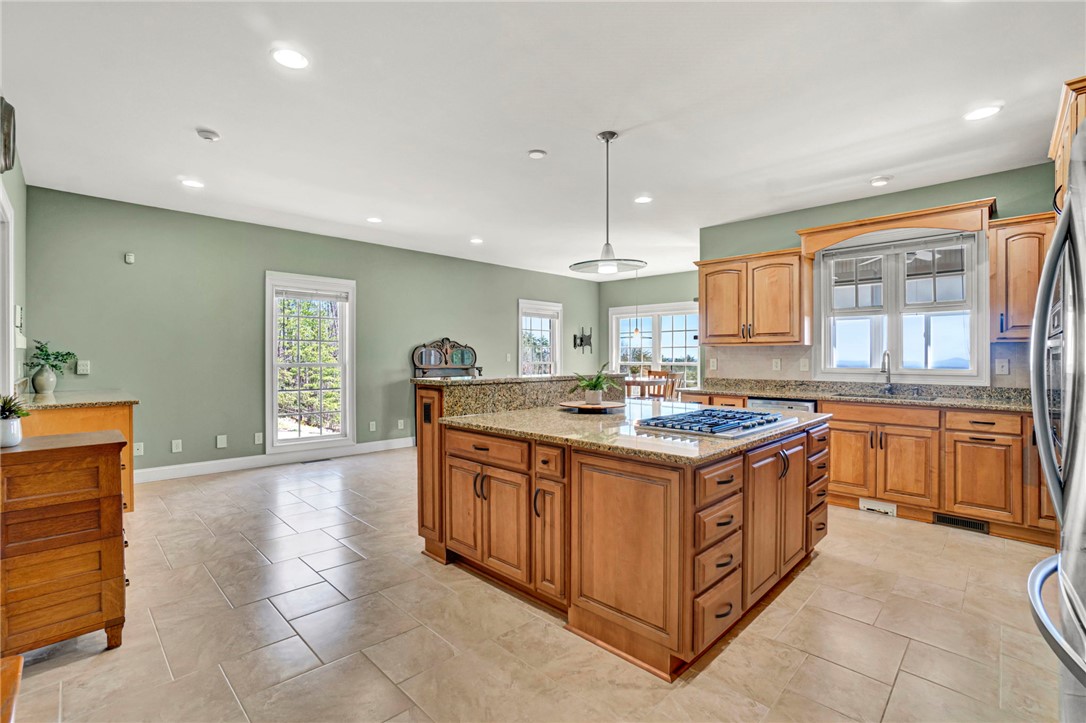 603 Tamassee Ridge Way Salem, SC 29676 - Photo 16 of 46 This expansive kitchen features a central island, ample cabinetry, and abundant natural light.