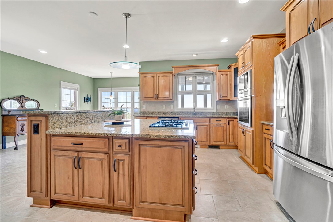 603 Tamassee Ridge Way Salem, SC 29676 - Photo 17 of 46 This kitchen features a central island, granite countertops, and modern appliances perfect for culinary pursuits.