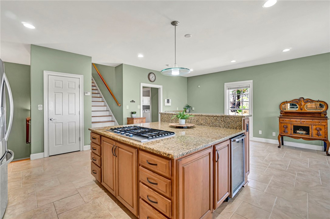 603 Tamassee Ridge Way Salem, SC 29676 - Photo 19 of 46 This kitchen features a central island with cooktop and elegant granite countertops.