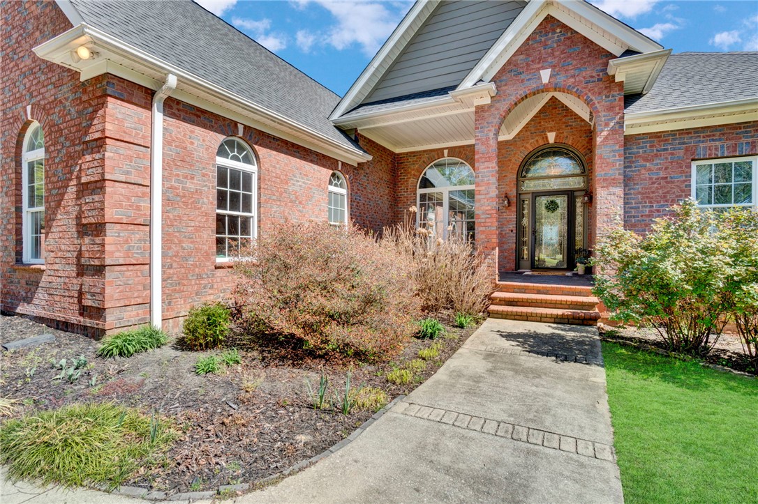 603 Tamassee Ridge Way Salem, SC 29676 - Photo 2 of 46 This classic brick residence features an inviting arched entryway, framed by well-maintained landscaping.
