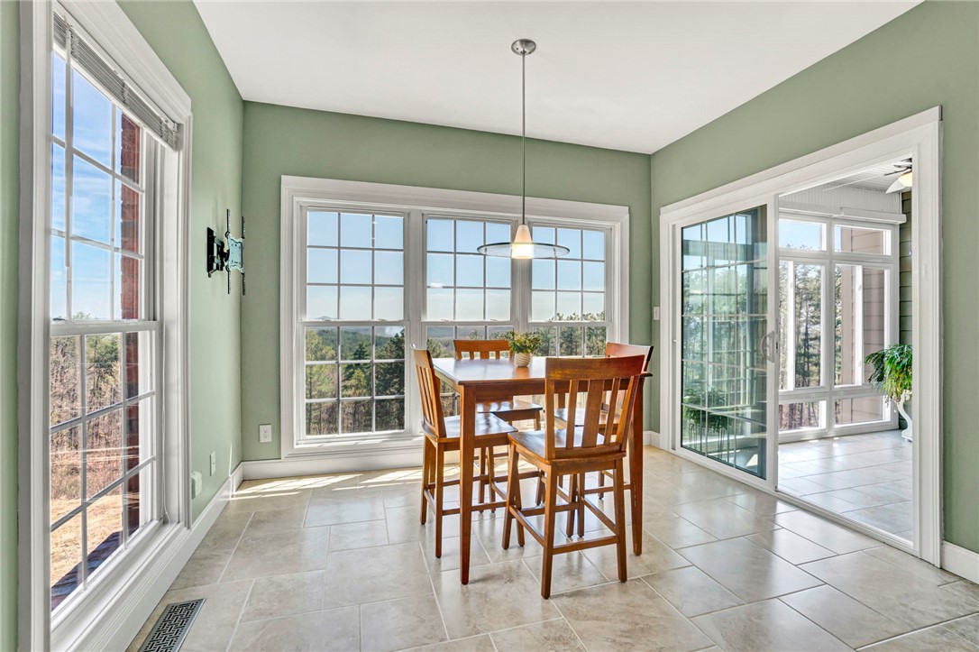 603 Tamassee Ridge Way Salem, SC 29676 - Photo 22 of 46 This bright dining area offers expansive outdoor views, perfect for memorable meals.