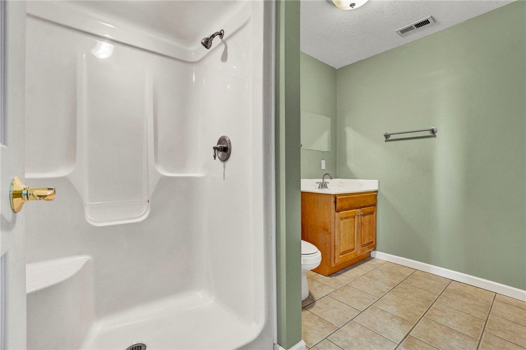 603 Tamassee Ridge Way Salem, SC 29676 - Photo 26 of 46 This bathroom features practical tile flooring and a functional shower for everyday convenience.