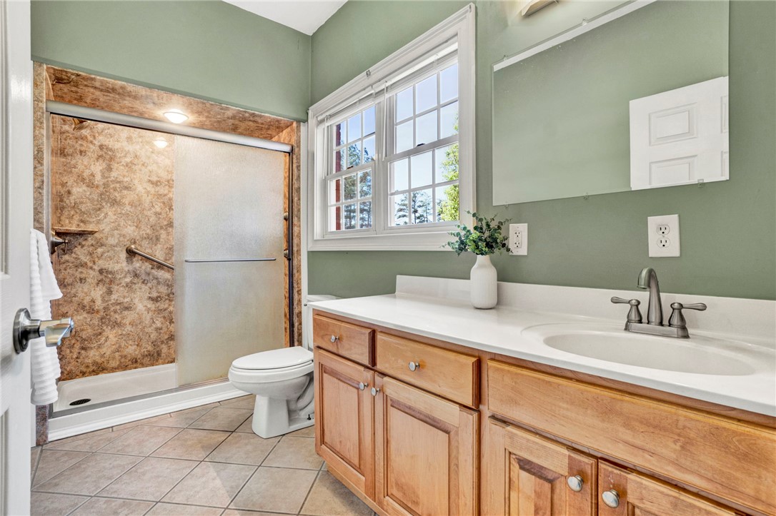 603 Tamassee Ridge Way Salem, SC 29676 - Photo 34 of 46 This bathroom features a sleek vanity, a spacious shower, and ample natural light.