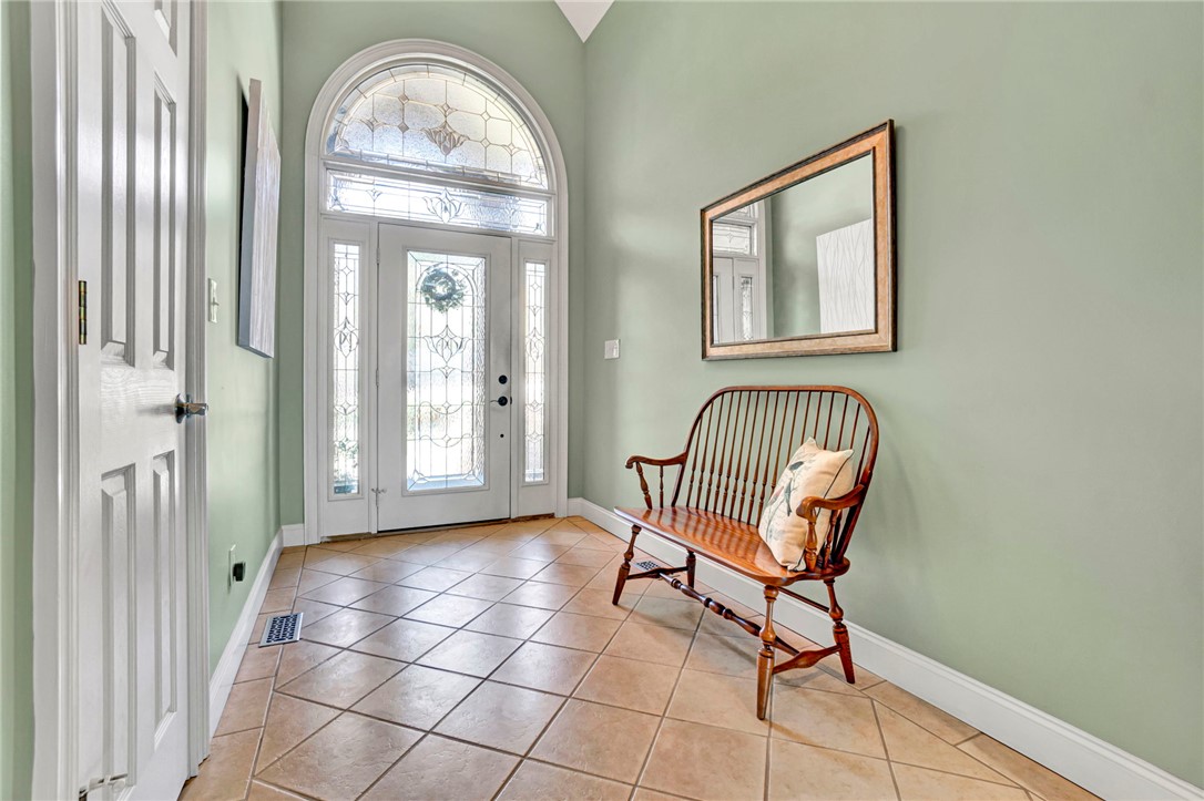 603 Tamassee Ridge Way Salem, SC 29676 - Photo 7 of 46 Enter into a welcoming foyer with elegant tiled flooring and an arched entryway.