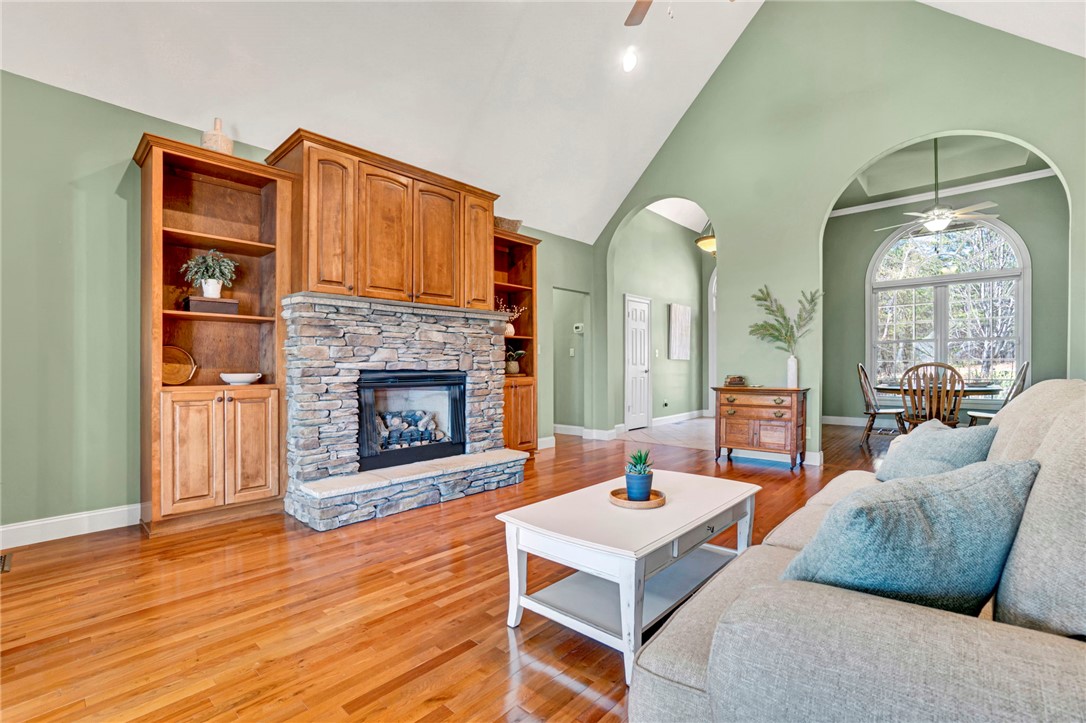 603 Tamassee Ridge Way Salem, SC 29676 - Photo 9 of 46 This inviting space features a captivating fireplace and abundant natural light, creating an ideal gathering area.