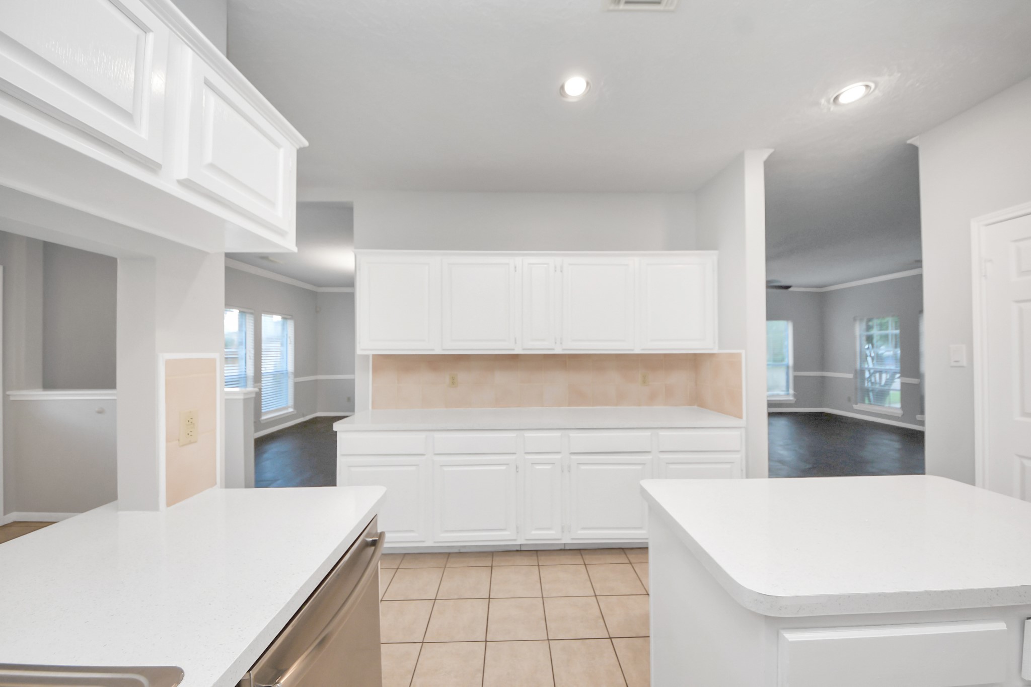 2102 Gemini Avenue Houston, TX 77058 - Photo 12 of 40 a kitchen with a refrigerator and wooden floor