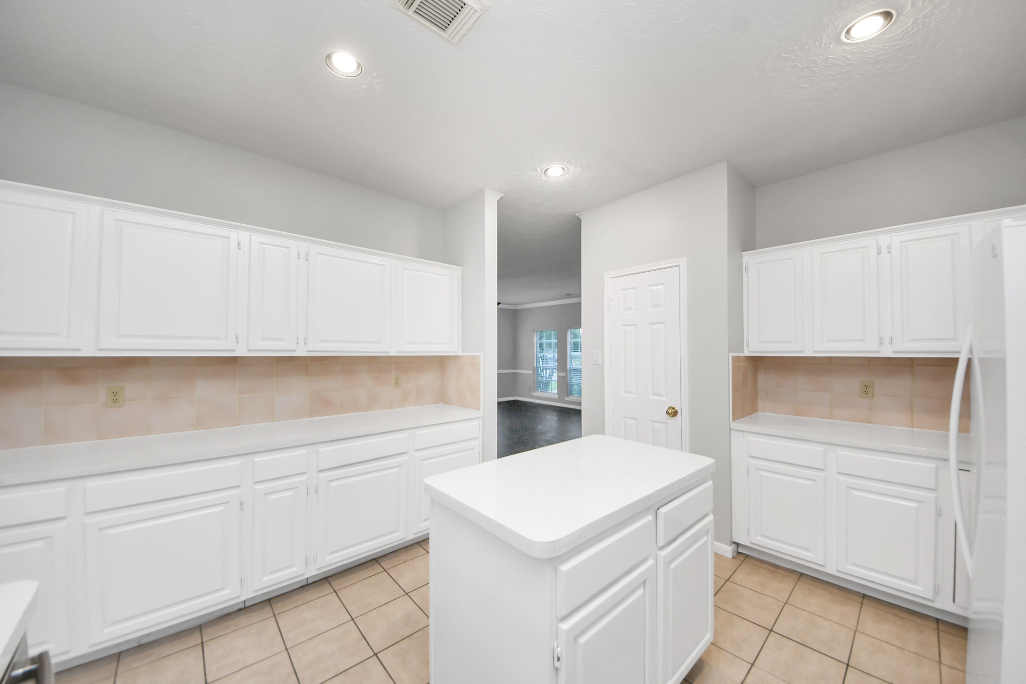 2102 Gemini Avenue Houston, TX 77058 - Photo 13 of 40 a kitchen with a stove cabinets and a counter top space