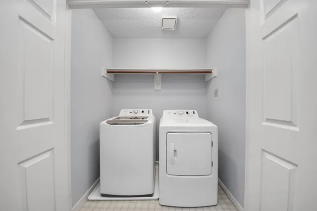 a utility room with dryer and washer