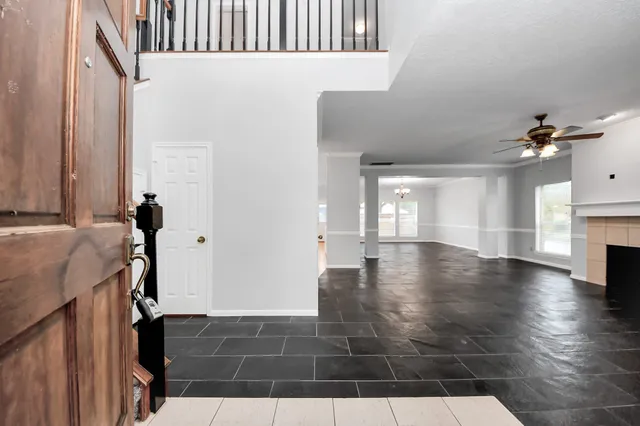 a view of an entryway with wooden floor