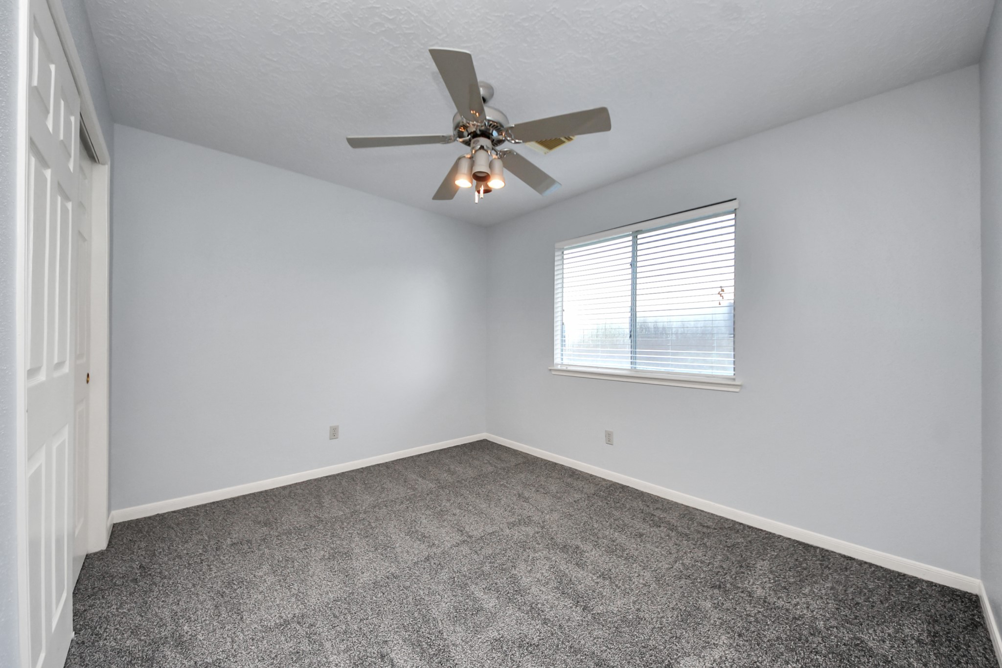 2102 Gemini Avenue Houston, TX 77058 - Photo 22 of 40 an empty room with windows and fan