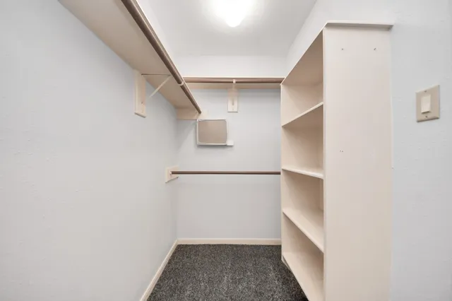 a view of an empty walk in closet