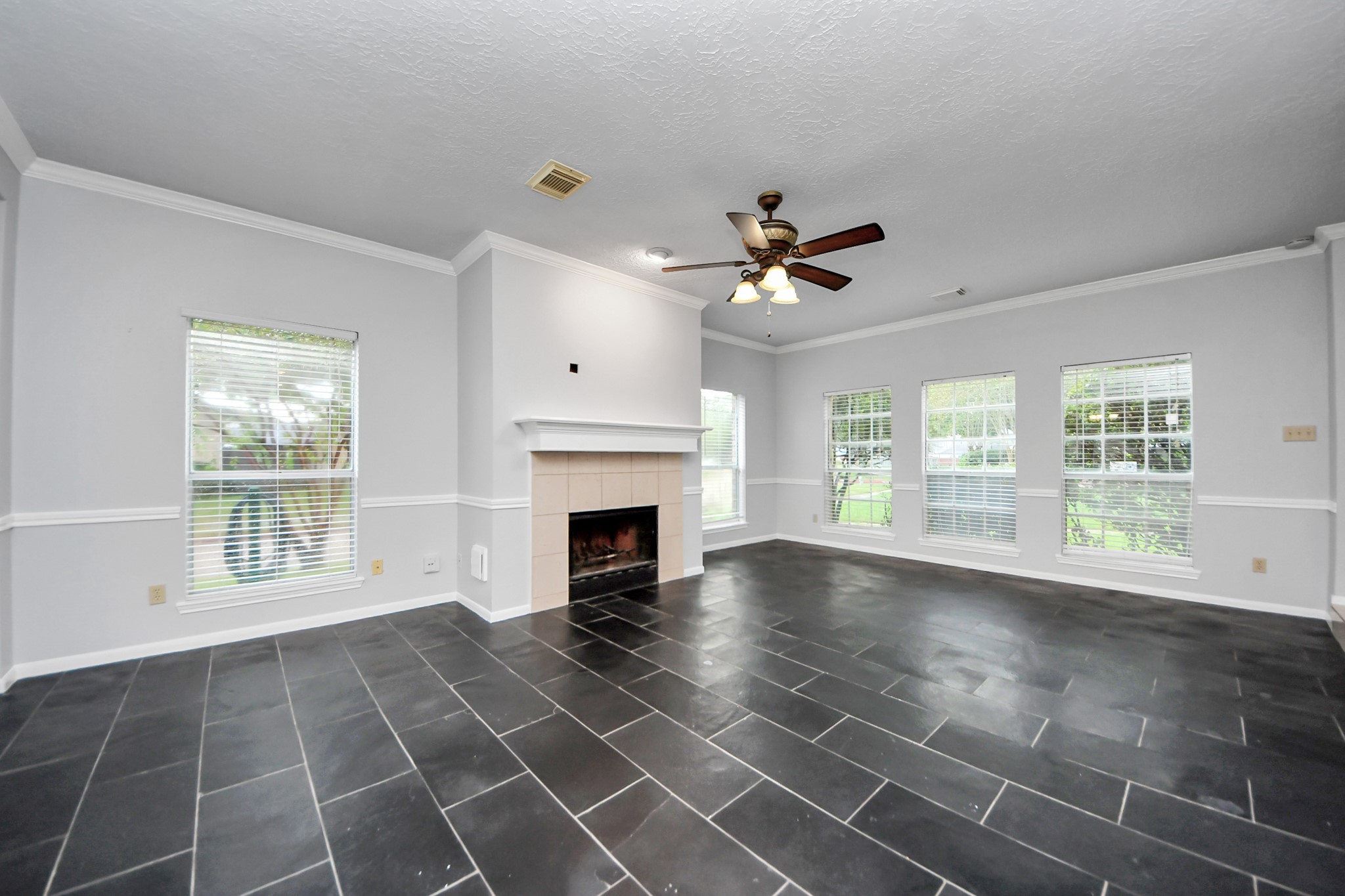 2102 Gemini Avenue Houston, TX 77058 - Photo 5 of 40 a view of an empty room with a fireplace and a window