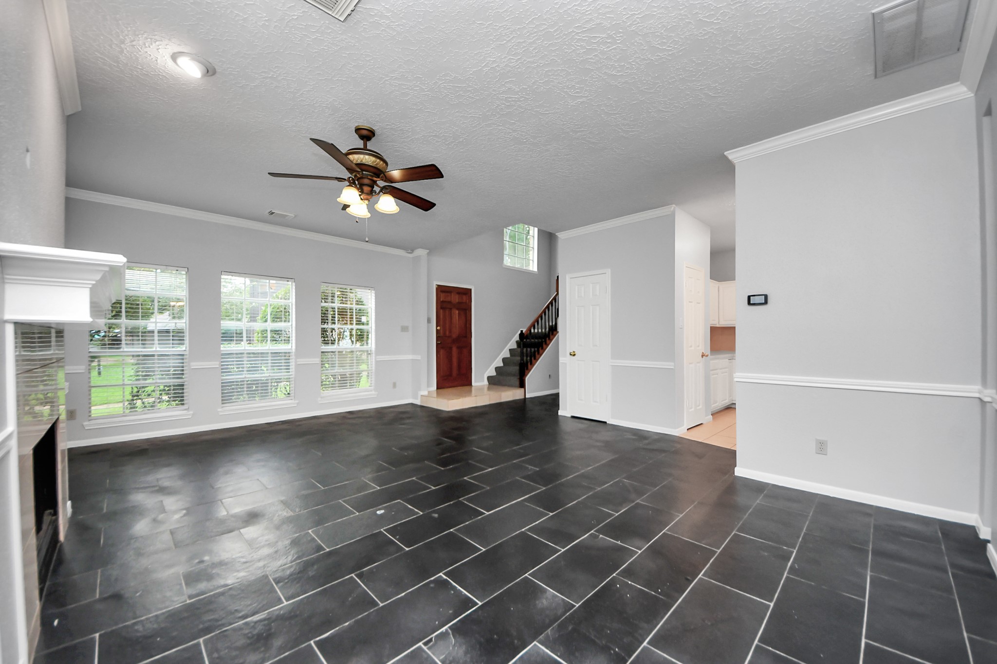 2102 Gemini Avenue Houston, TX 77058 - Photo 6 of 40 a view of an empty room with a window and wooden floor