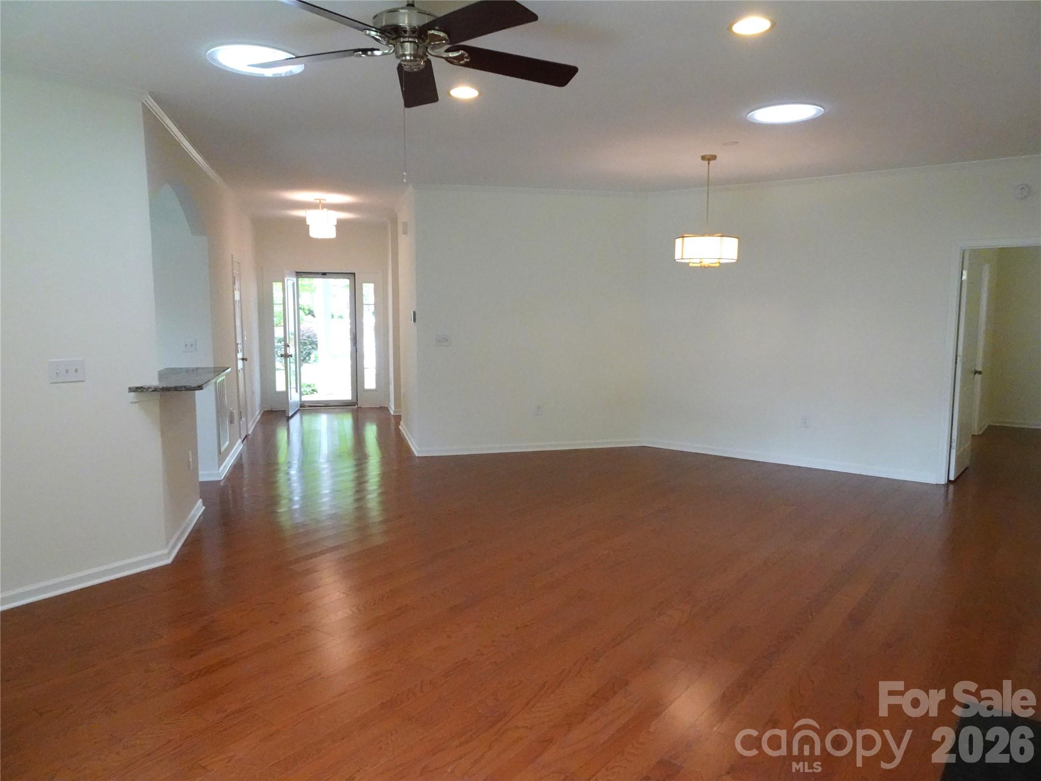 35 Sheffield Place Brevard, NC 28712 - Photo 12 of 38 a view of empty room with wooden floor and fan