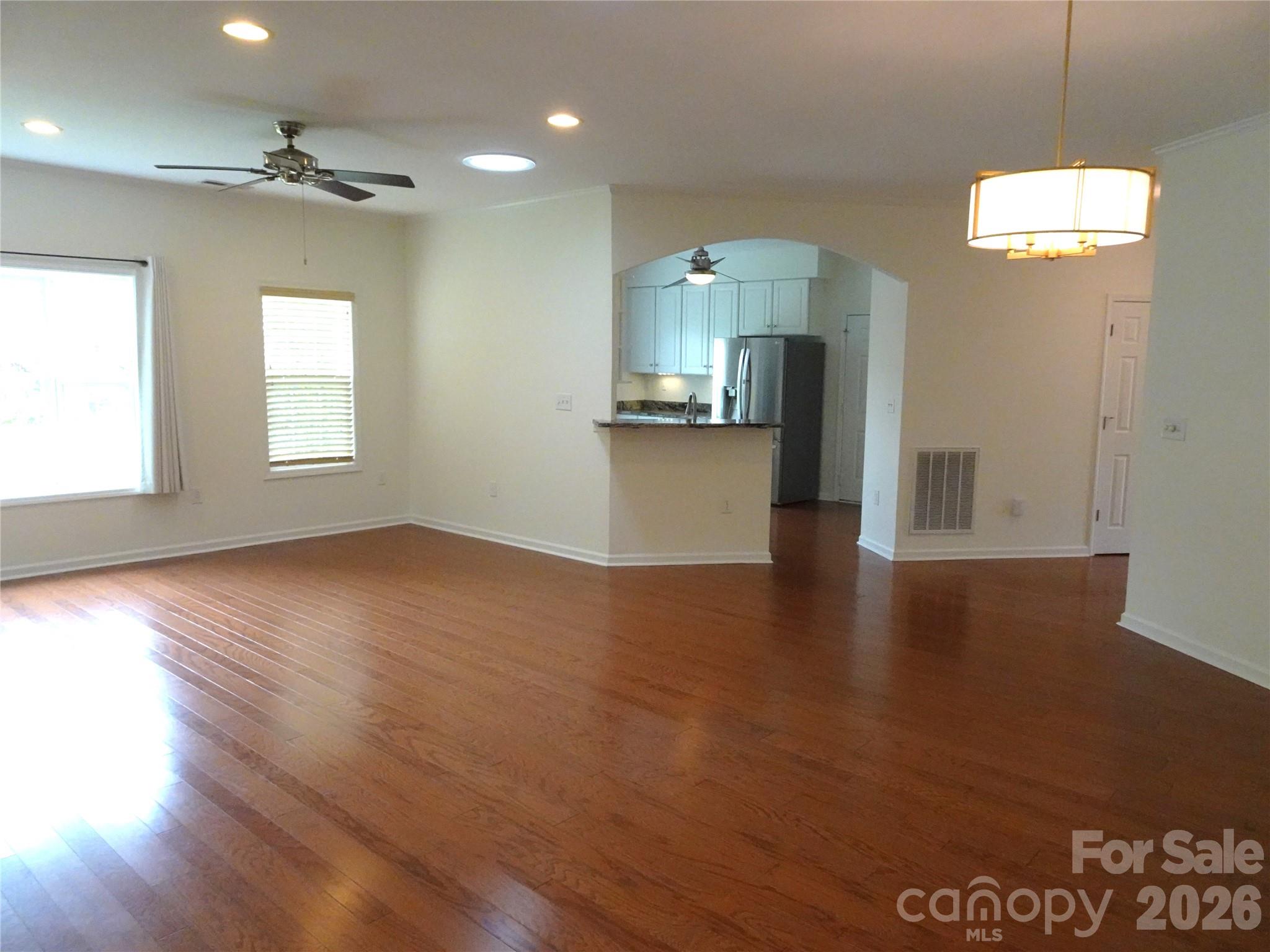 35 Sheffield Place Brevard, NC 28712 - Photo 14 of 38 a view of empty room with wooden floor and fan