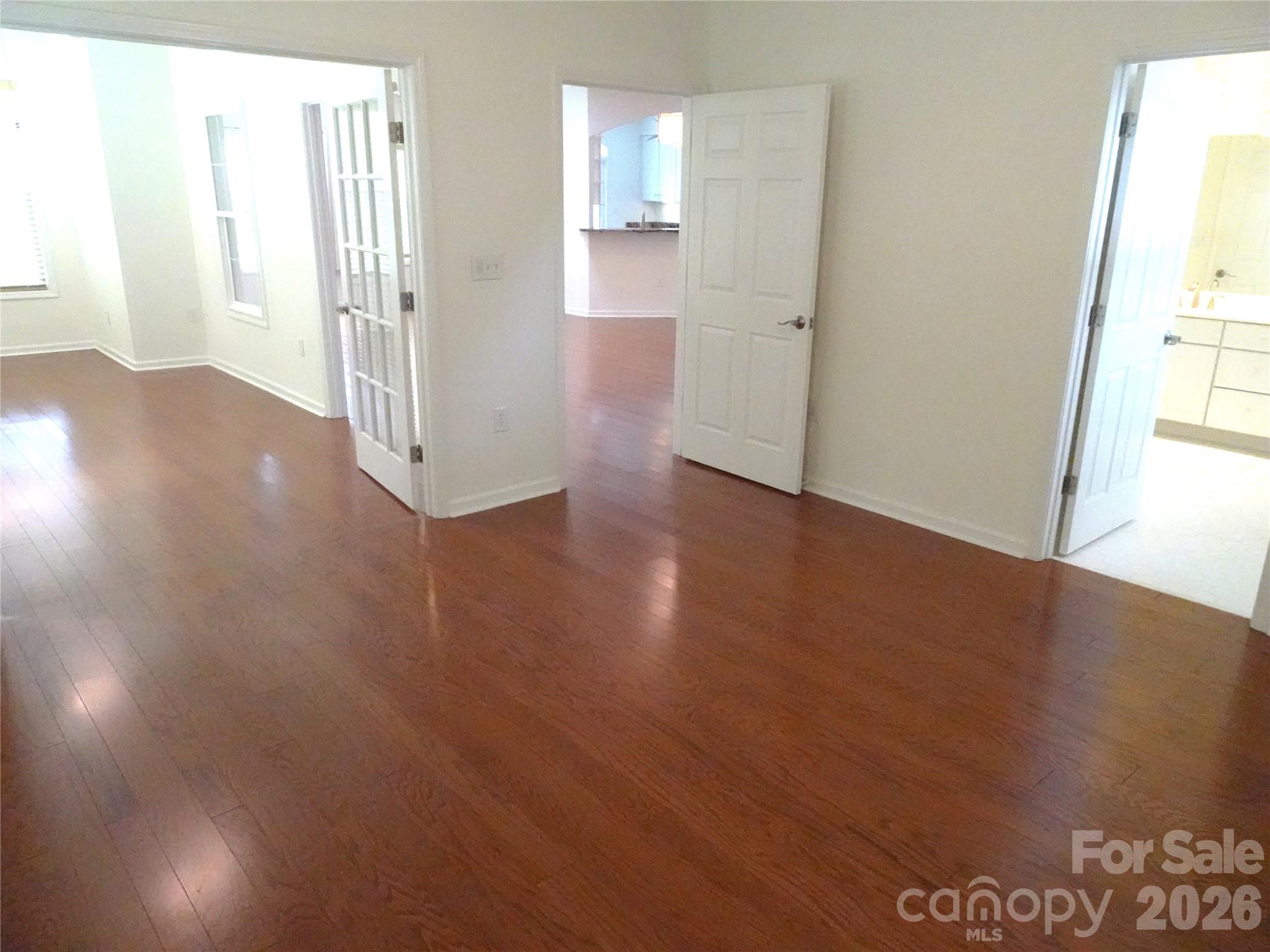 35 Sheffield Place Brevard, NC 28712 - Photo 19 of 38 an empty room with wooden floor and windows