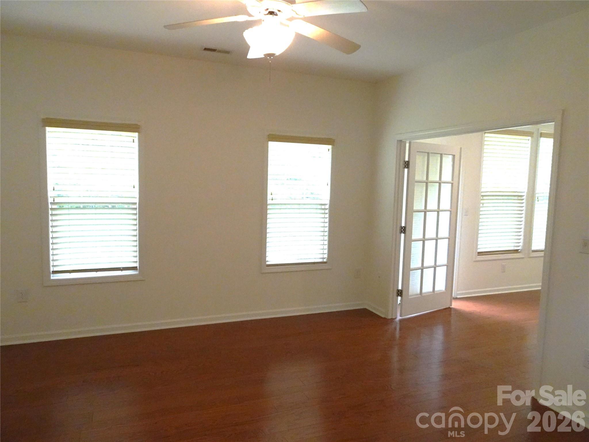 35 Sheffield Place Brevard, NC 28712 - Photo 21 of 38 a view of an empty room with wooden floor and a window