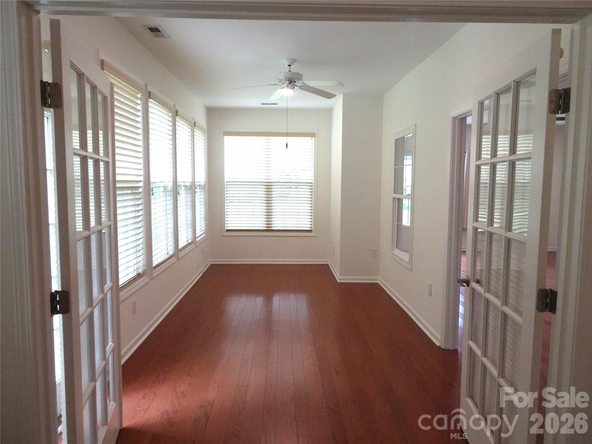 35 Sheffield Place Brevard, NC 28712 - Photo 22 of 38 a view of an empty room with wooden floor and a window