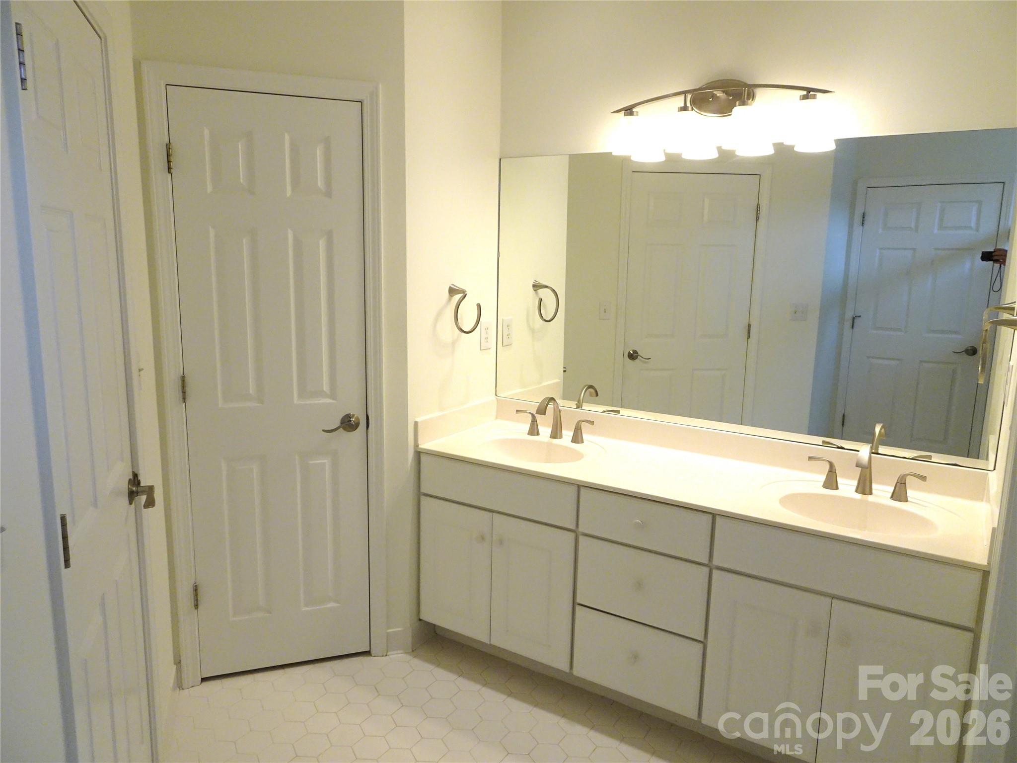 35 Sheffield Place Brevard, NC 28712 - Photo 24 of 38 a bathroom with a double vanity sink mirror and