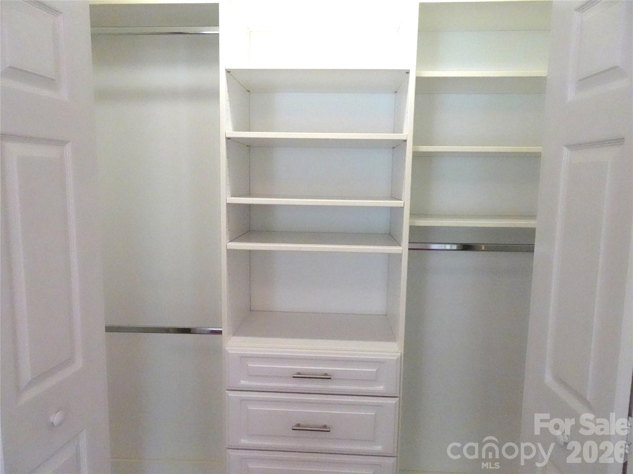 35 Sheffield Place Brevard, NC 28712 - Photo 27 of 38 a view of walk in closet with empty racks