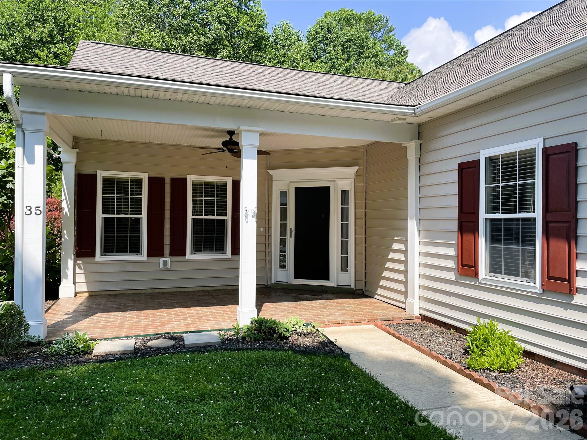 35 Sheffield Place Brevard, NC 28712 - Photo 3 of 38 a front view of a house with a yard