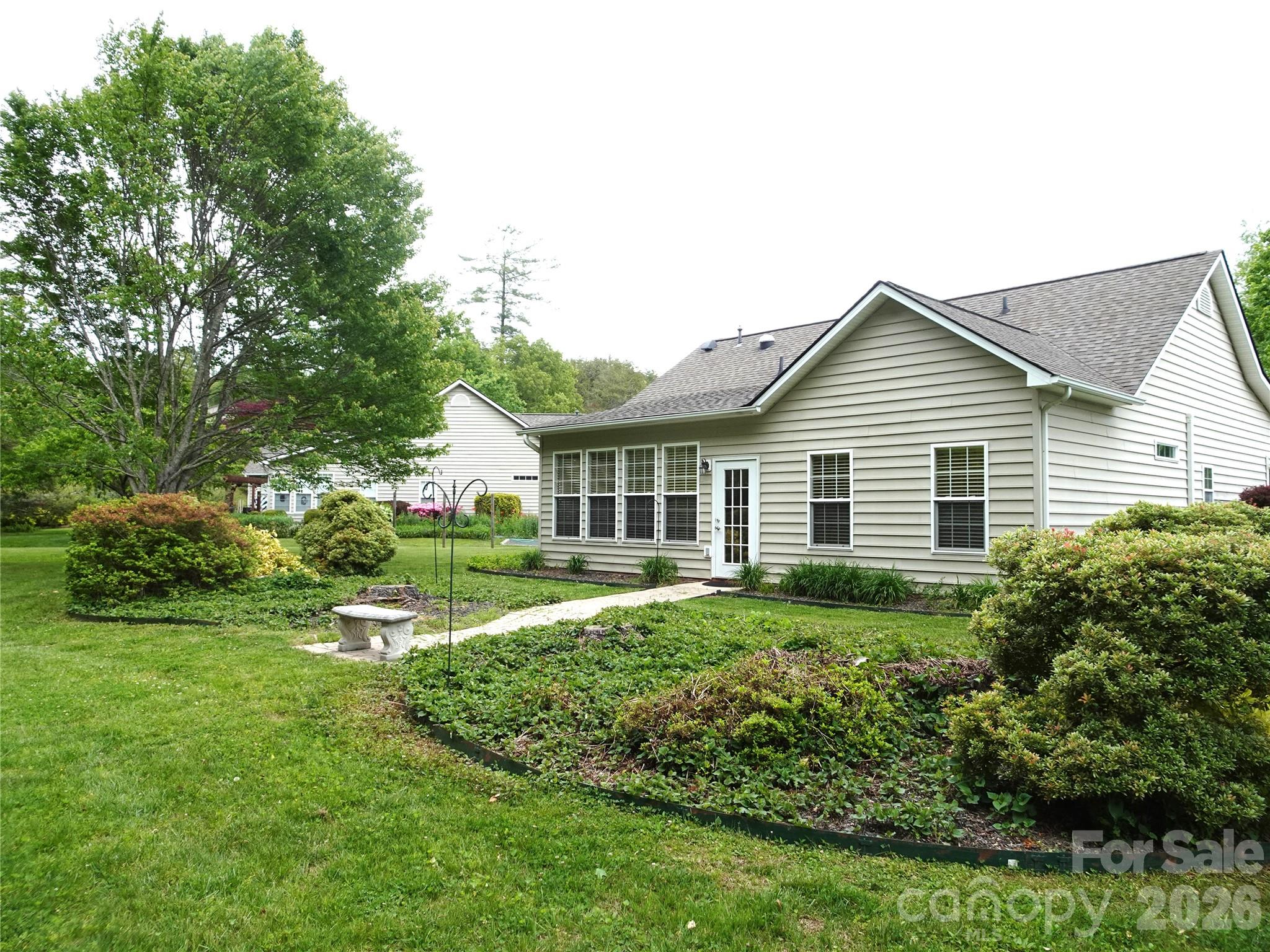 35 Sheffield Place Brevard, NC 28712 - Photo 6 of 38 a view of a house with backyard and garden