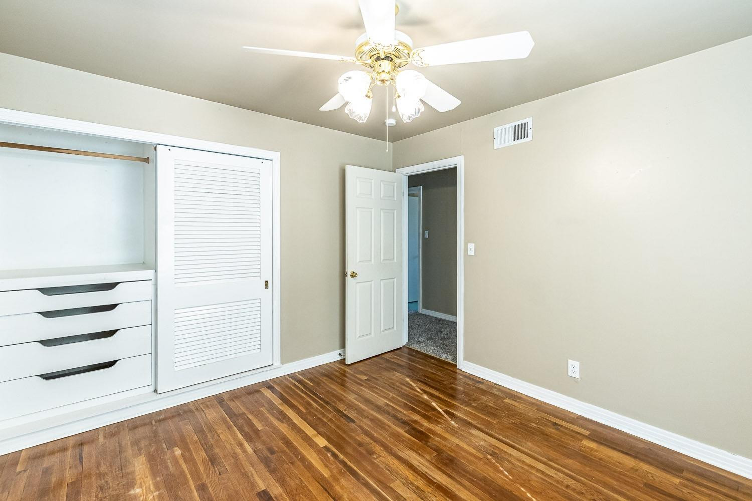 3708 27th Street Lubbock, TX 79410 - Photo 17 of 23 wooden floor in an empty room