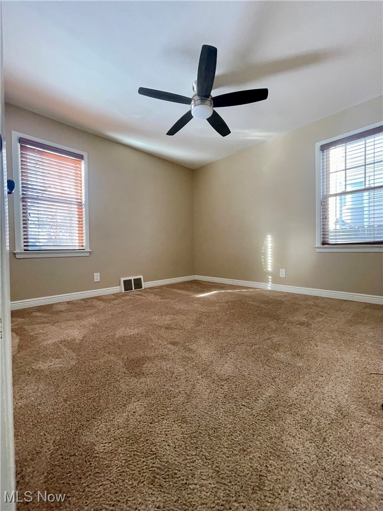 1544 Edgefield Road Lyndhurst, OH 44124 - Photo 17 of 36 Unfurnished room featuring baseboards and light colored carpet