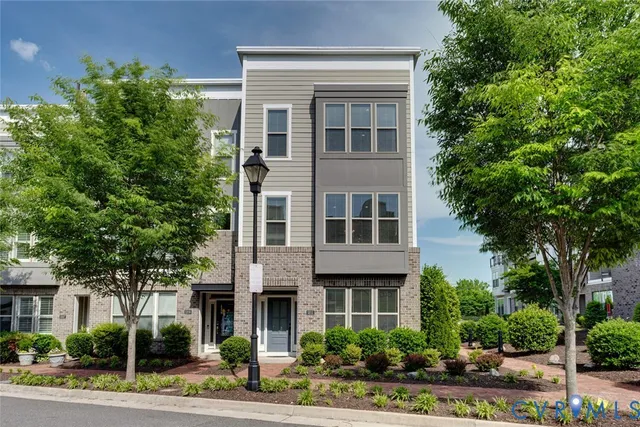 a view of a building with a yard