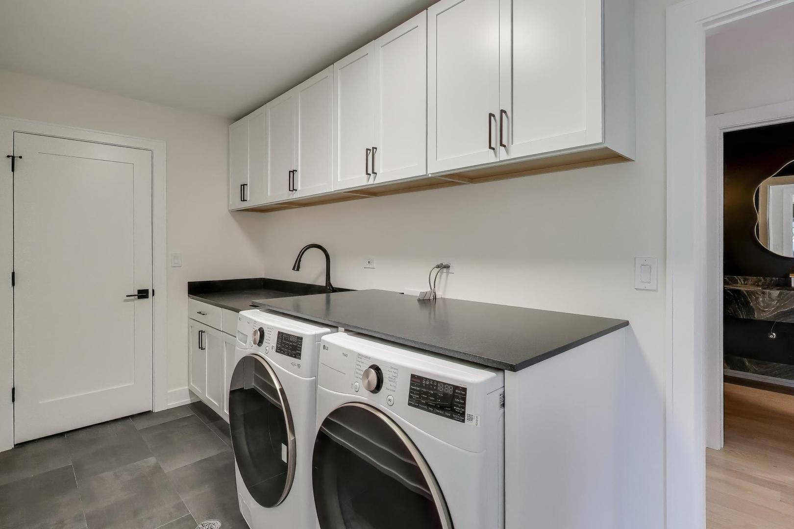 73 Augusta Drive Deerfield, IL 60015 - Photo 13 of 39 a utility room with sink dryer and washer