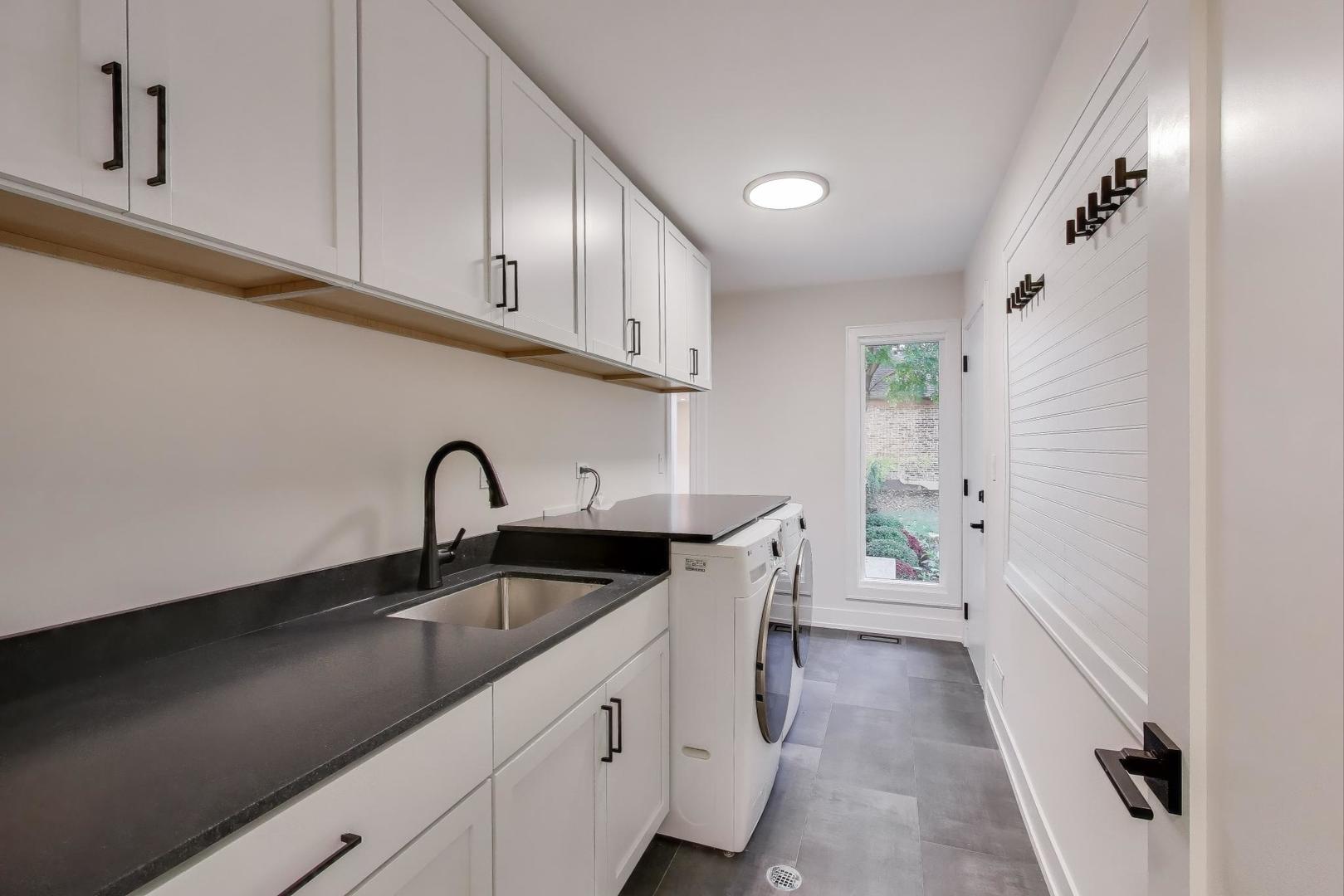 73 Augusta Drive Deerfield, IL 60015 - Photo 14 of 39 a kitchen with a sink and cabinets