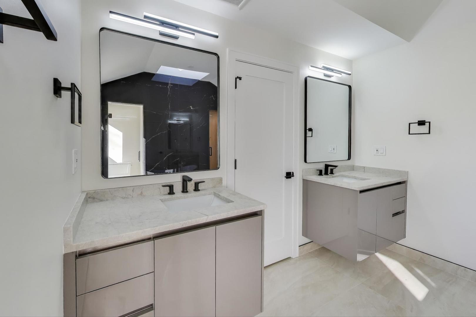 73 Augusta Drive Deerfield, IL 60015 - Photo 20 of 39 a bathroom with a double vanity sink and a mirror