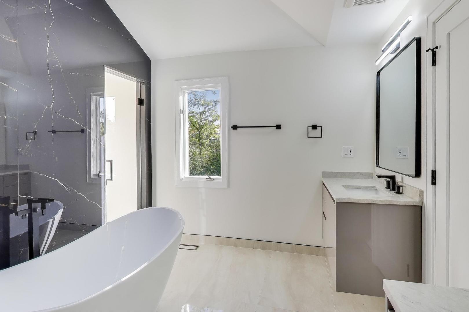73 Augusta Drive Deerfield, IL 60015 - Photo 21 of 39 a bathroom with a bathtub sink and mirror