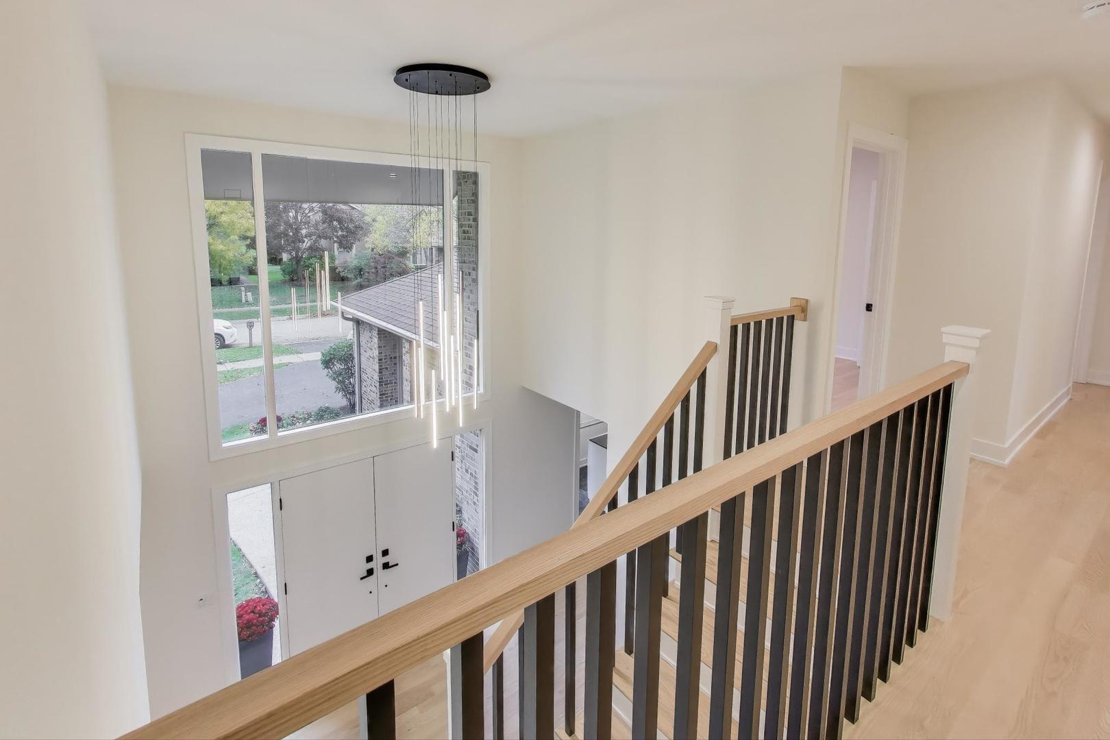 73 Augusta Drive Deerfield, IL 60015 - Photo 4 of 39 a view of staircase with railing and white walls