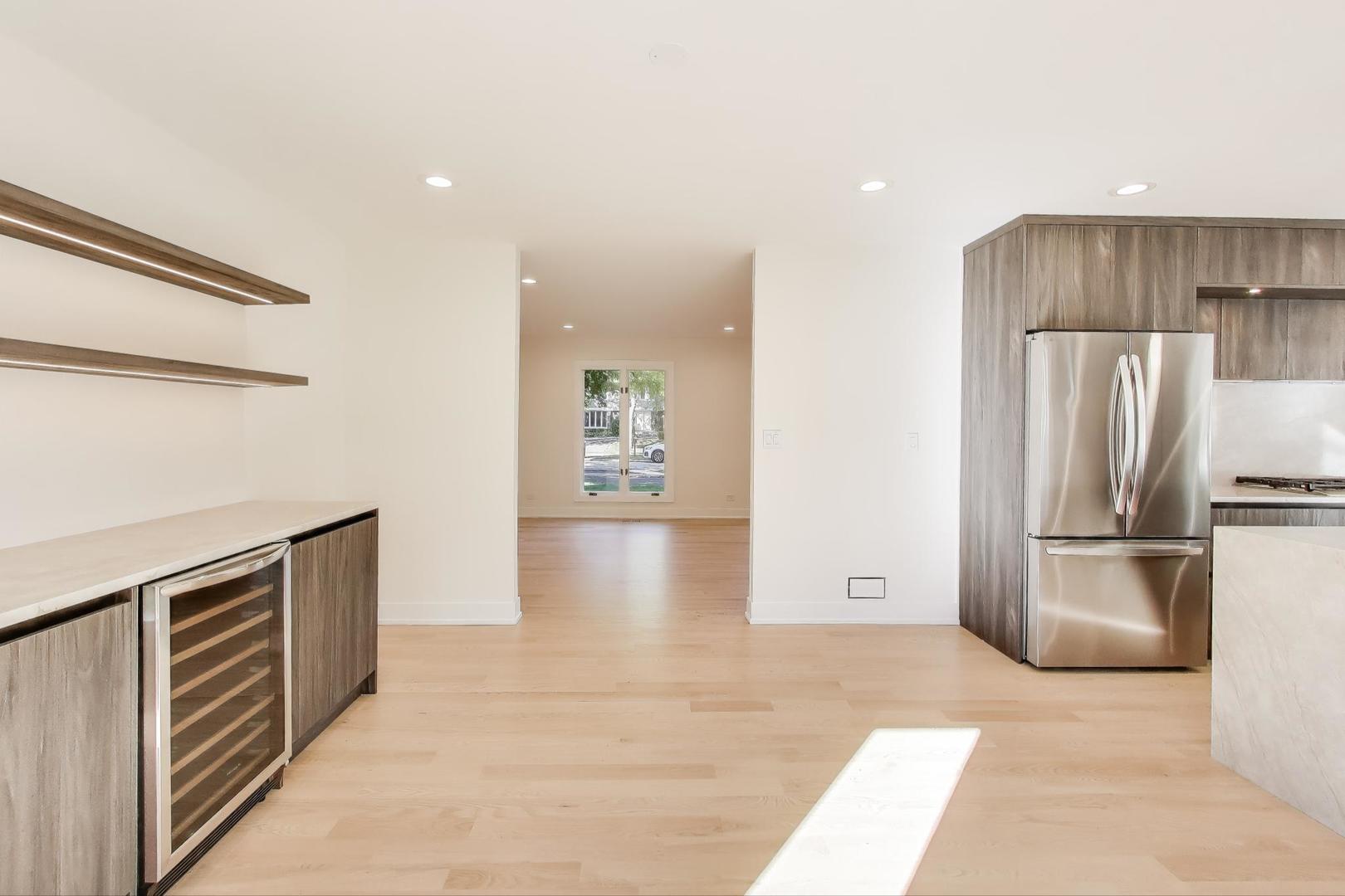 73 Augusta Drive Deerfield, IL 60015 - Photo 10 of 39 a kitchen with stainless steel appliances a refrigerator and a stove top oven