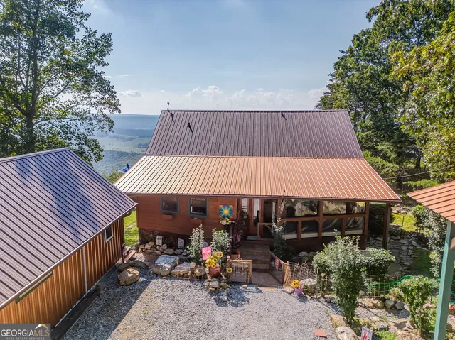 a room with pool table and chairs