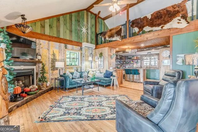a bedroom with furniture and a flat screen tv