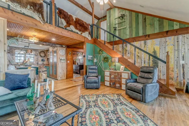 a bathroom with a sink mirror and a shower